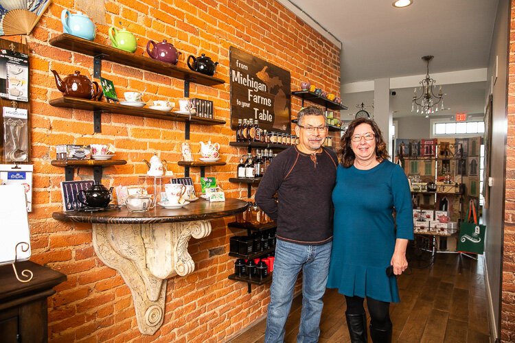 Tony and Sheryl Trujillo, owners of Agua  Dolce, a coffee and tea shop in downtown Monroe, stand inside their business.