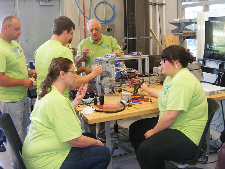 Wave Water Works team, Professor Michael A. Latcha, Ph.D. - School of Engineering and Computer Science and students at work in the labs this past semester. Courtesy OU.