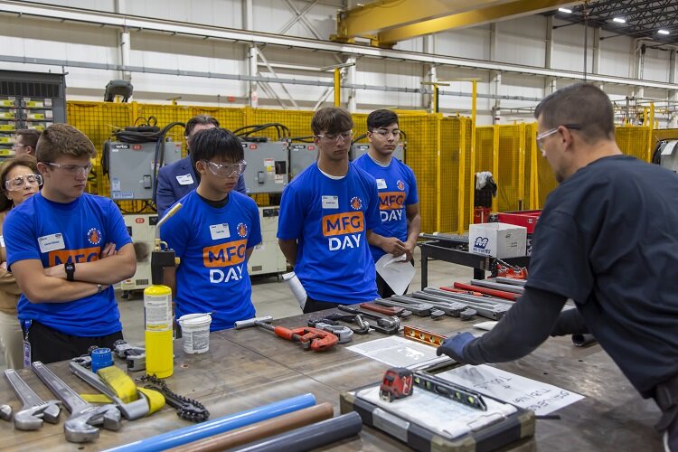 Macomb students visit a Paslin facility on Manufacturing Day.