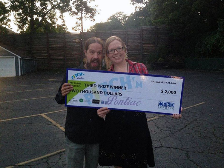 Ashleigh Altemann and Evan Monaghan with their Pitch Pontiac winnings. 