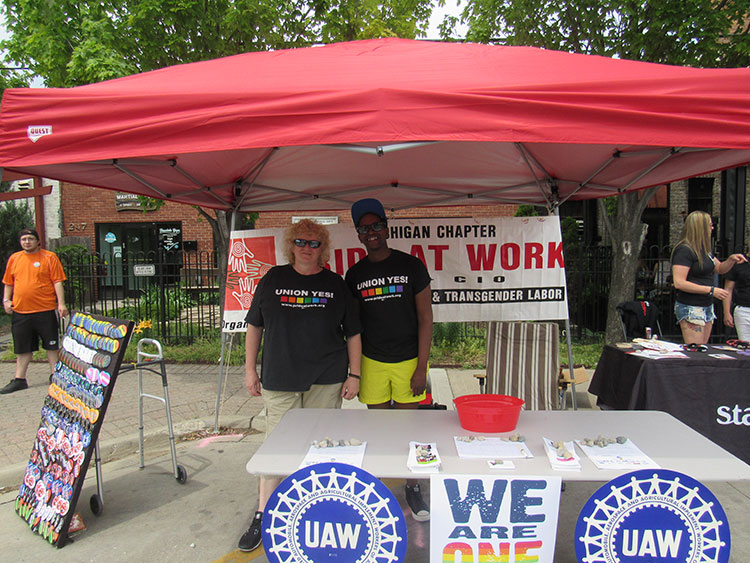 ill Daniels, right, with a member of Pride at Work Michigan, Photo by Micah Walker.
