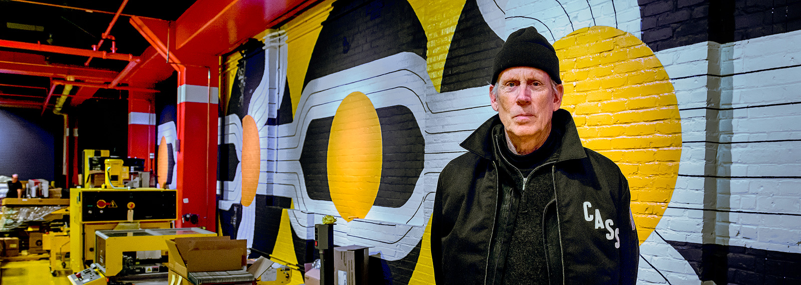 Robert Sestock in front of his mural at Third Man Pressing in the Cass Corridor 