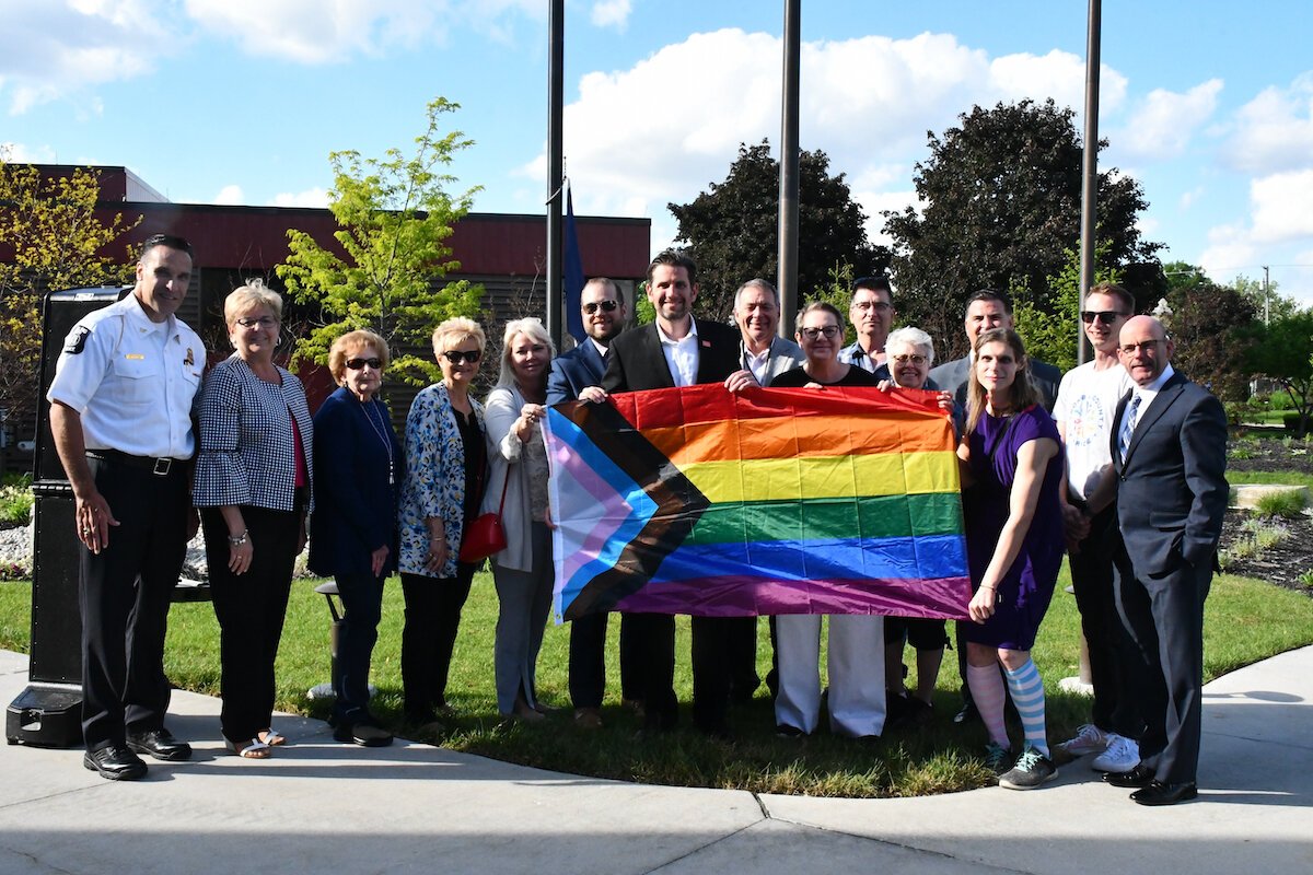 Sterling Heights Mayor and City Council, Sterling Heights Administration, members of the Sterling Heights CommUNITY Alliance and members of Macomb County Pride raise the Pride flag at Sterling Heights City Hall for Pride month in June 2022.