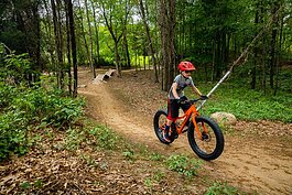 A young rider takes a spin at Stony Creek Metropark.