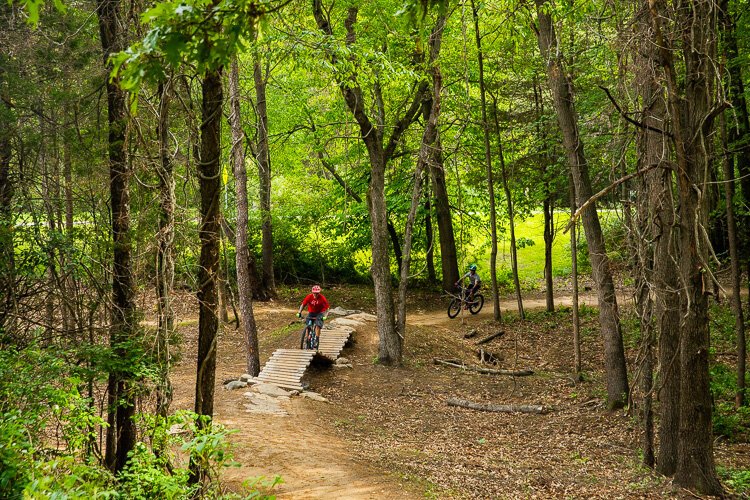 A mountain biker checks out a ramp at Stony Creek.