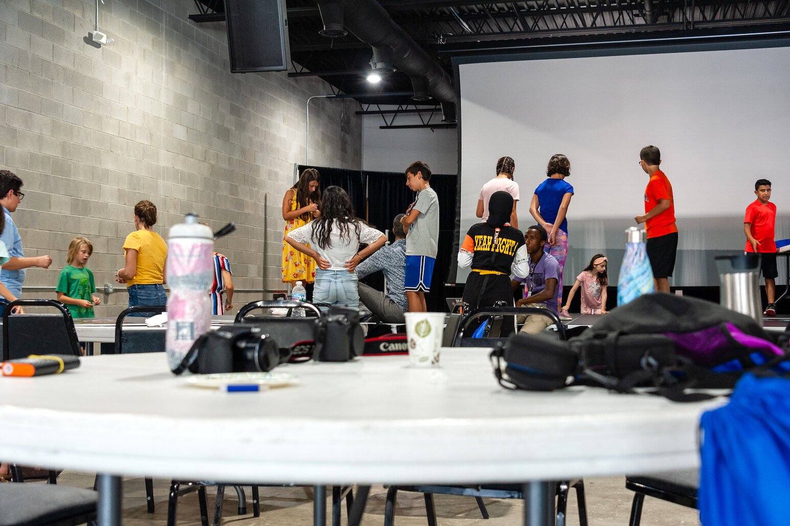 SURA students learning photography in Dearborn.