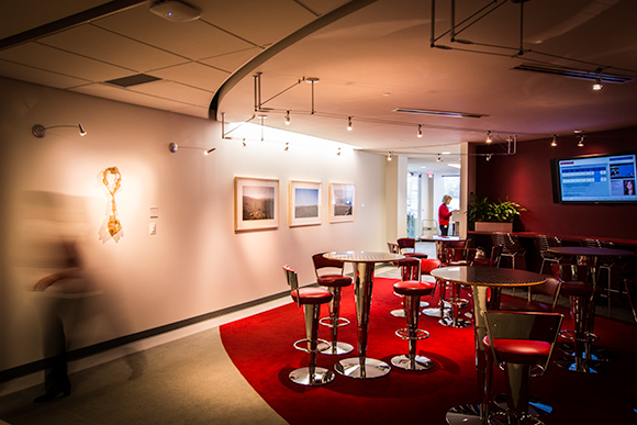 Sculpture and photographs are part of the Crabrook Academy of Art exhibition on display at Mercedes-Benz Financial Services. Shown here, the art interacts with the space and the people