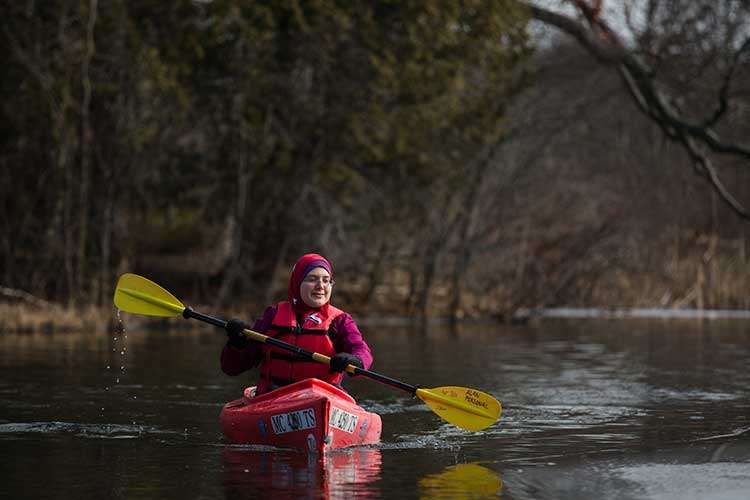 Ameera Chaaban kayaks the Huron River in Proud Lake State Park. She serves as the President of the Friends of Proud Lake.