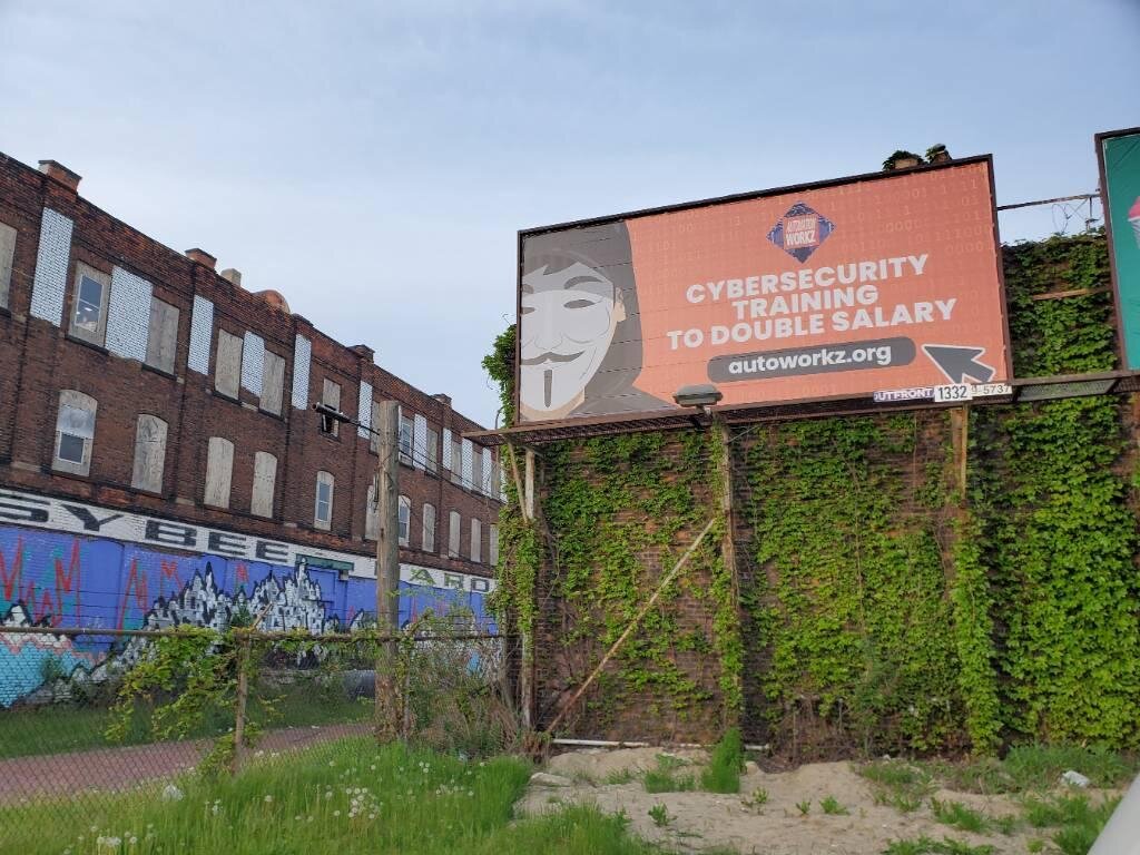 A billboard in Detroit advertises Automation Workz's cybersecurity bootcamp.