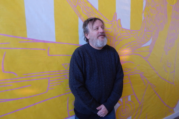 Artist Tim Hailey with his piece at Public Pool