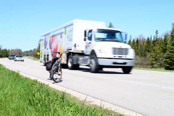 U.S. 2, named this year as U.S. Bicycle Route 10, has wide shoulders and rumble strips. Bikers eventually get used to logging and Faygo trucks zooming past them