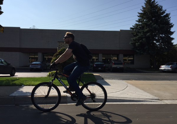 A cyclist rides in a bike lane on W. 9 Mile Road in Ferndale