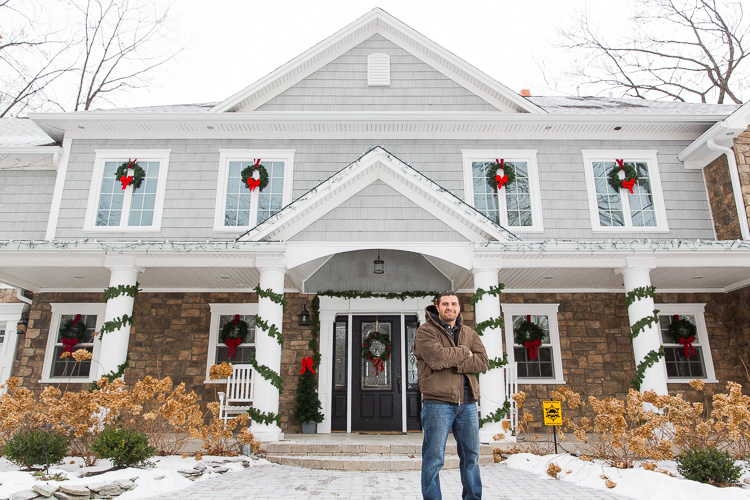 Mike Hammoud in front of his bigfoot house in Dearborn Heights