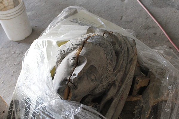 The disassembled Book Building caryatid