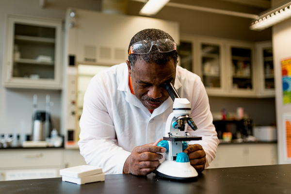 Young examines a sample