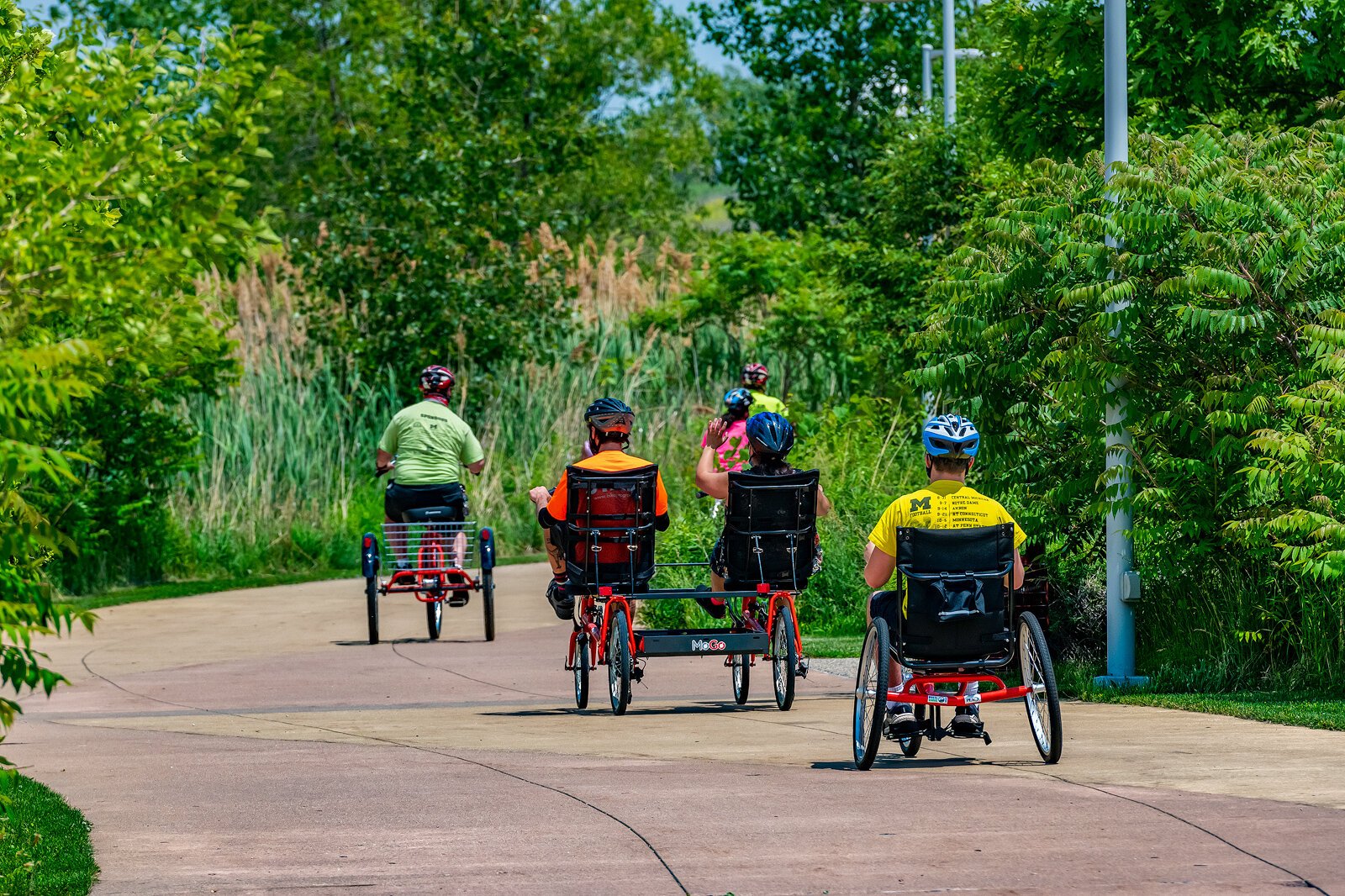 PEAC students ride MoGo adaptive cycles on the Detroit Riverwalk.