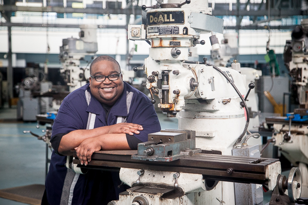 Ramone Horst next to a bridgeport machine at Focus:HOPE