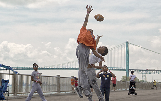 Kids play along the west riverfront