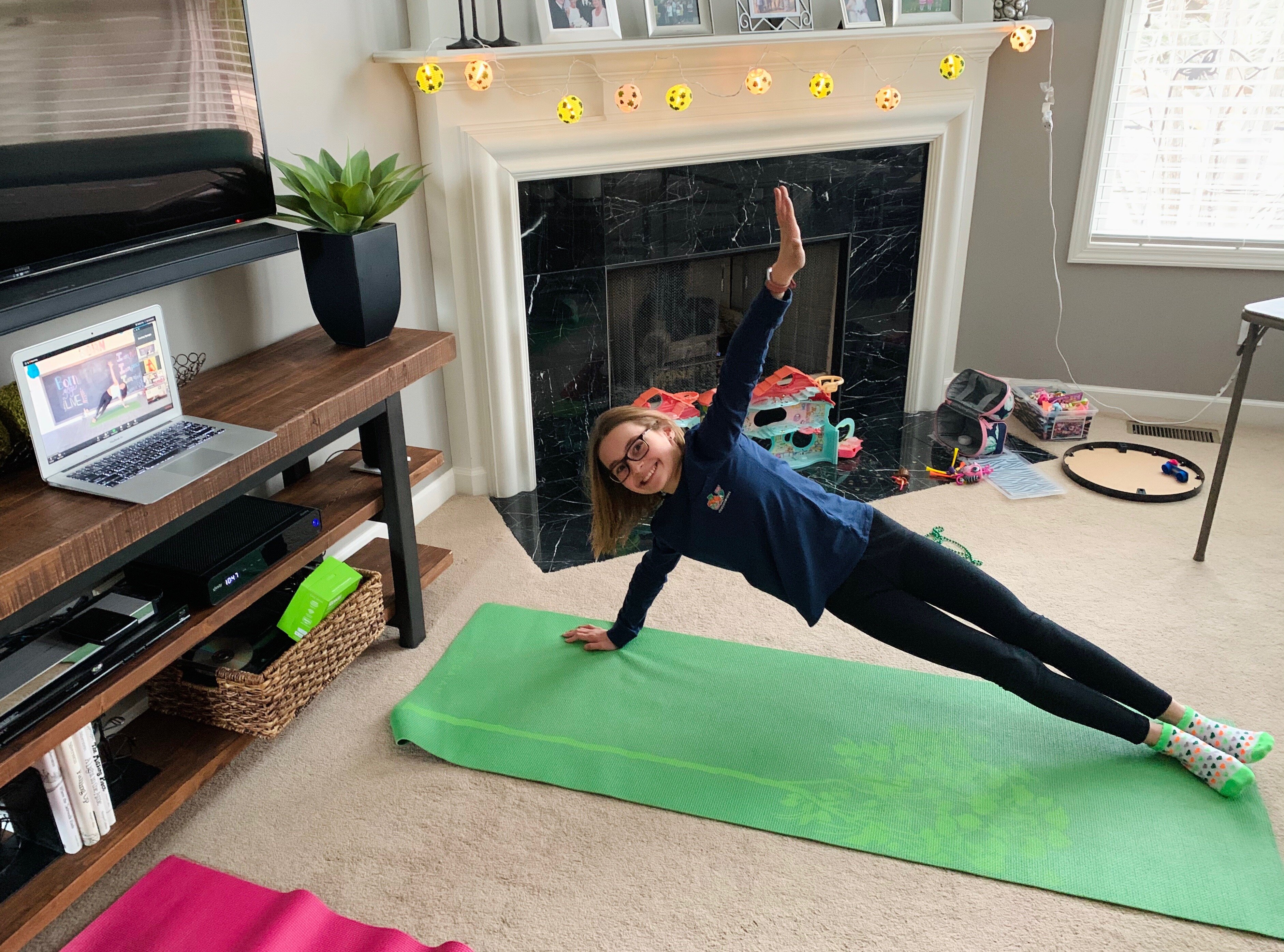 A Born Yoga participant joins a class from home during the COVID-19 shutdown.