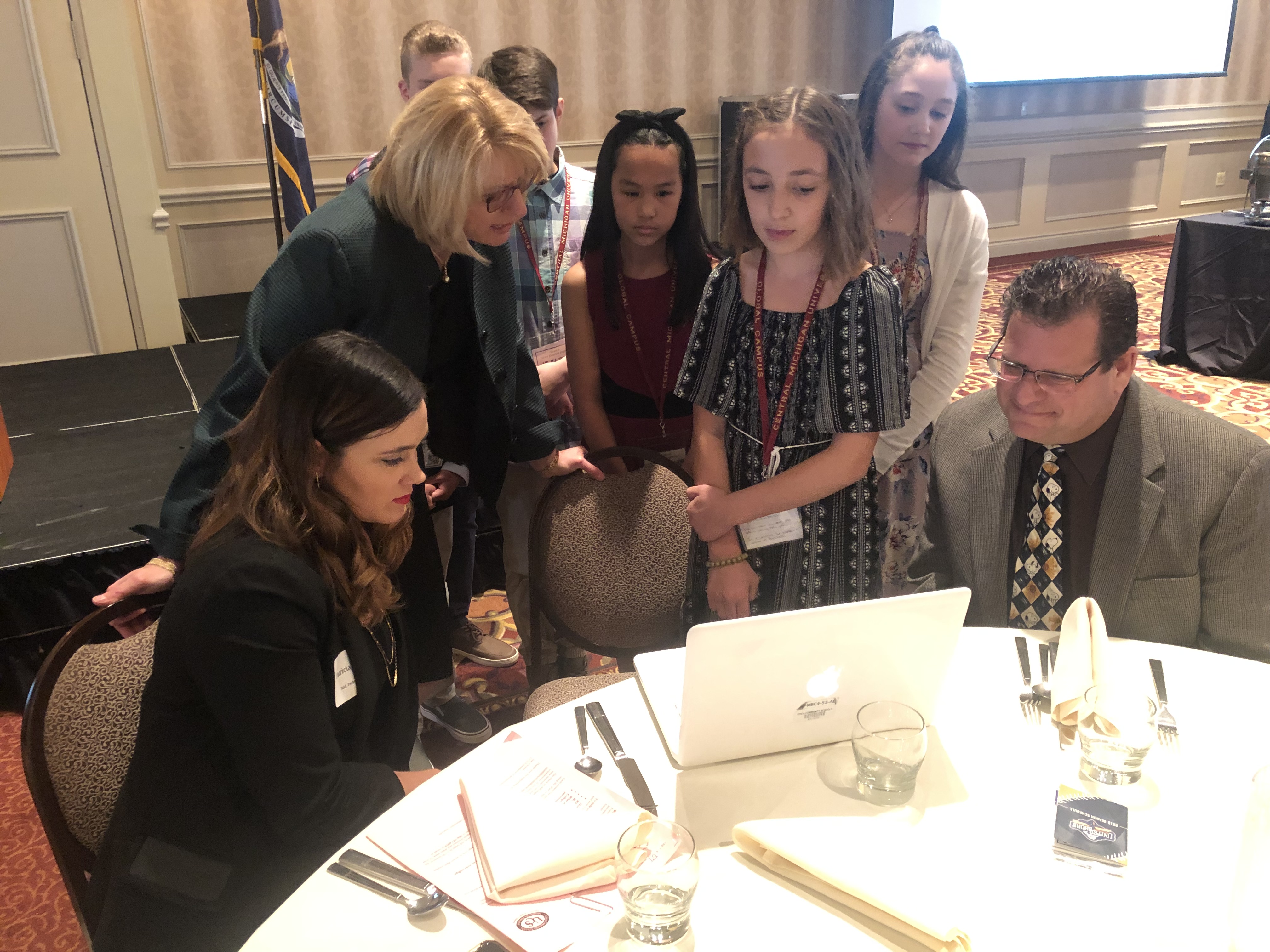 Speaker Patricia Lopez, UCS Superintendent Dr. Christine Johns, and Roberts Elementary Principal Wayne Johnson watch career videos made by Roberts Elementary students.