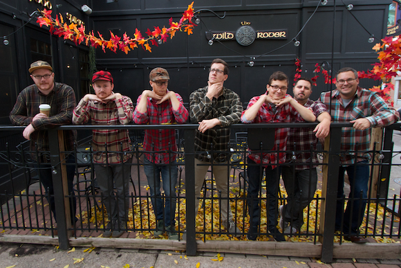 Employees of Elegant Seagulls celebrating Plaidurday downtown.