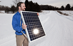 DUSTIN DENKINS OF SUBURB SOLAR SHOWCASES A PANEL THAT HELPS PRODUCE ENERGY- thumbnail - SHAWN MALONE