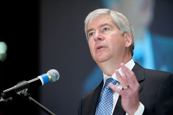 Governor Rick Snyder talks before a crowd. 