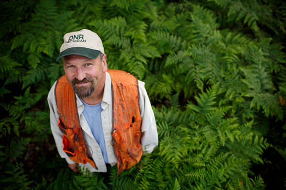 Bill Sterrett stands in a portion of maintained state forest land. It was clear cut about 35 years ago and has grown back.