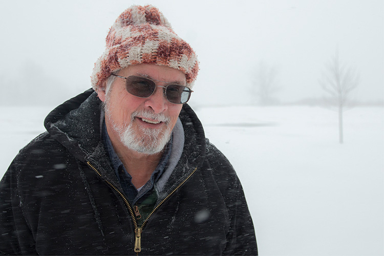 Bill Wright braves the snow at Saginaw bay.