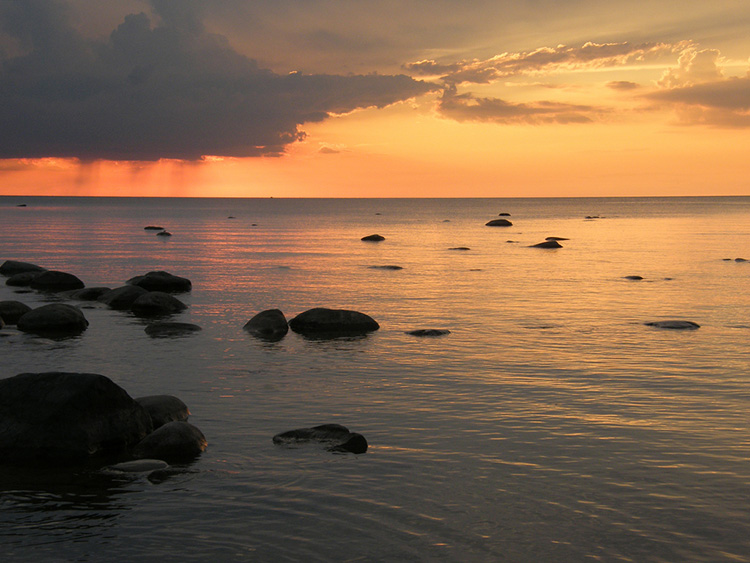 The sun rises at Saginaw Bay.