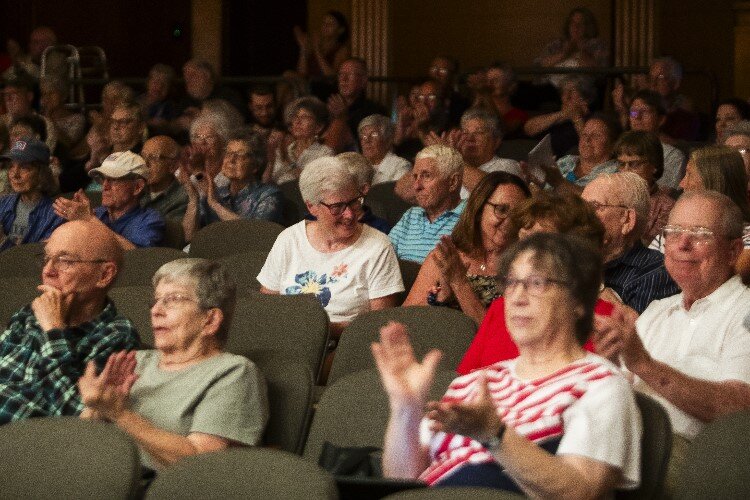 Audience members applaud during the Chemical City Band's performance on July 5.