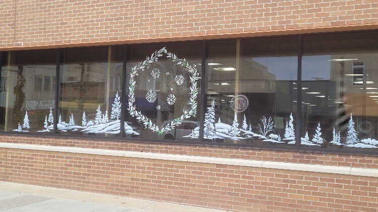 Downtown Midland window art by the Brush Monkeys.