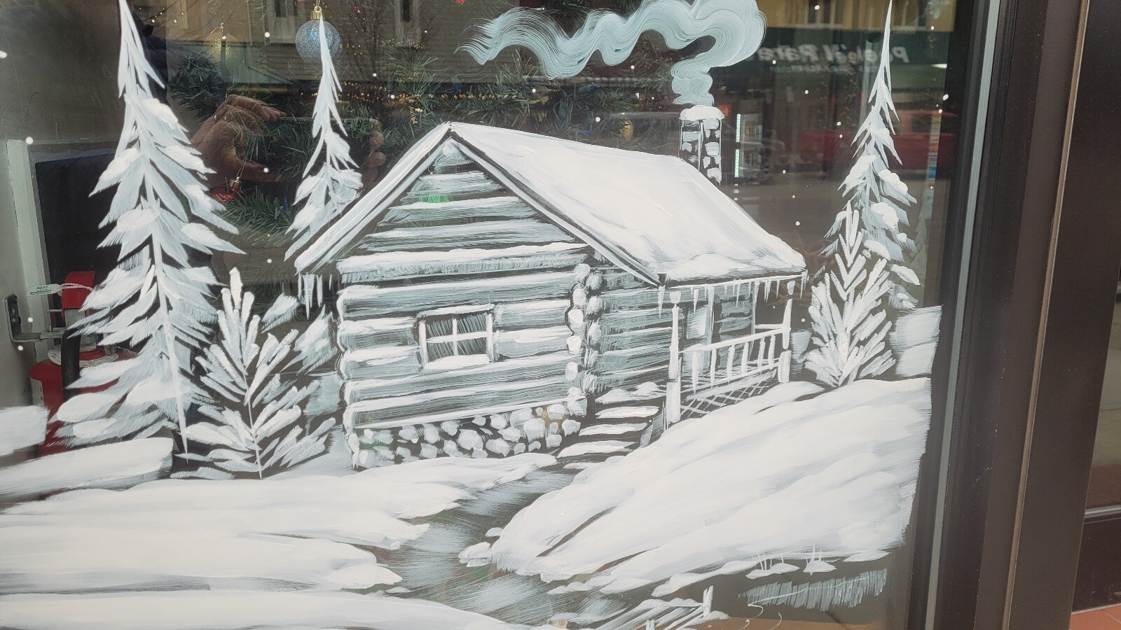 This log cabin is one of many paintings done by the Brush Monkeys.