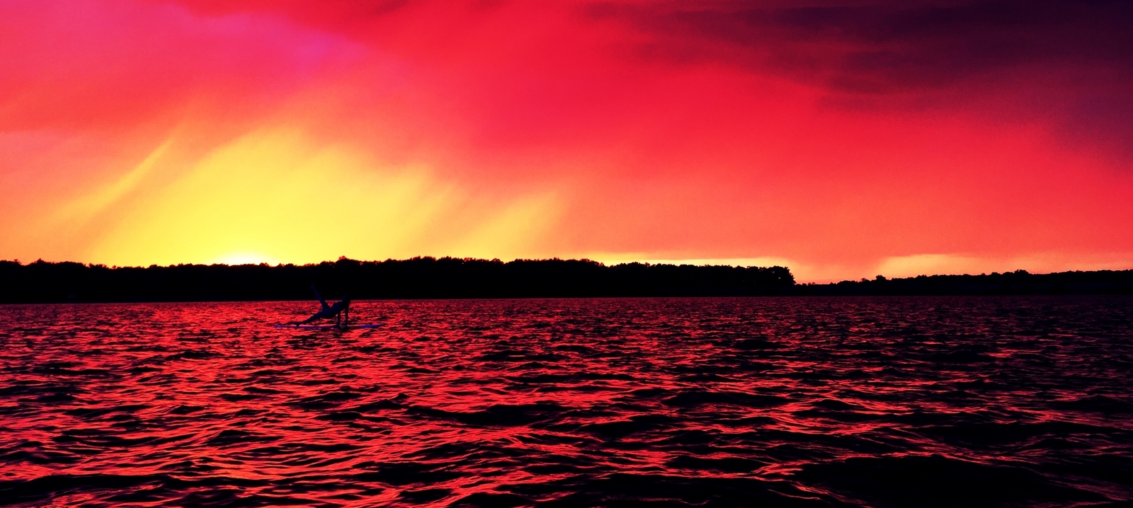 Paddle boarding at sunset on Sanford Lake