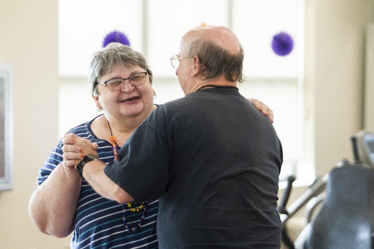 Jerilyn O'Connor, left, and Don Sprague, both residents of Pinecrest Farms, dance together while enjoying a live musical performance.