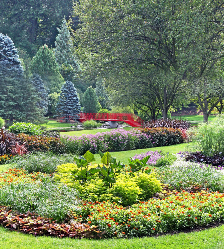 Dow Gardens covers 110 acres showcasing a display of annuals, perennials, water features, and towering pines. 