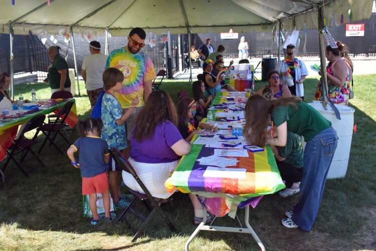 Great Lakes Bay Pride Festival attendees make crafts at the Jolt Credit Union Event Par