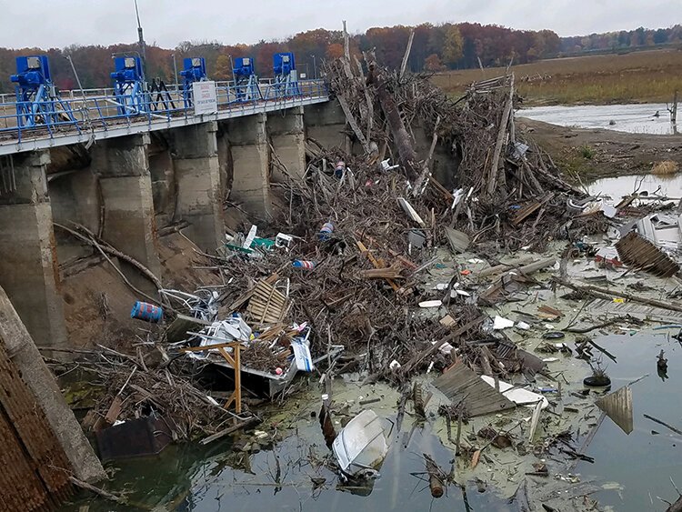 After the flood, there was an abundance of debris that needed to be removed at Sanford Dam.