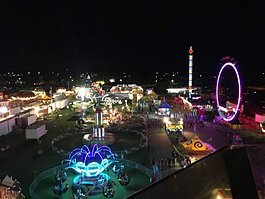 The Midland County Fair lights up the night.
