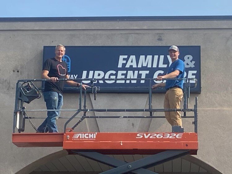 A new sign being installed at Gateway's new location.