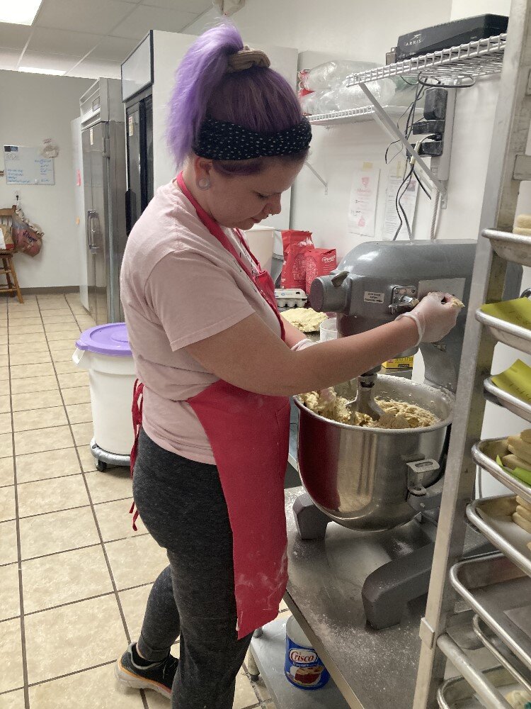 Gina Willman making dough for Dow's order of 2,800 cookies for its 125th anniversary celebration this week. 