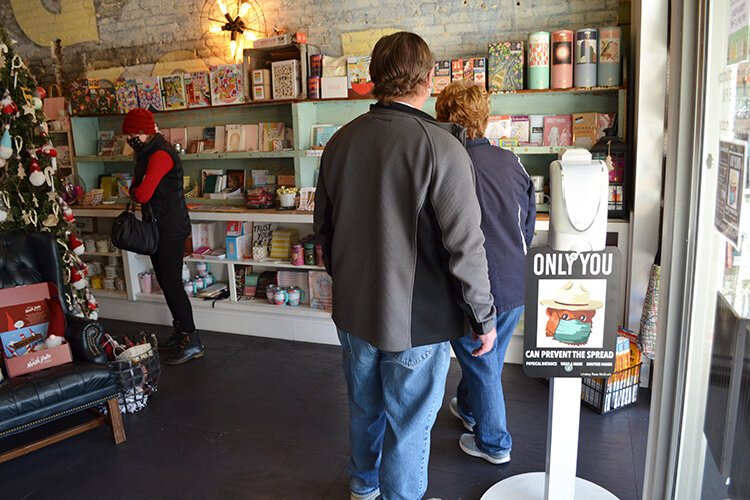 Serendipity Road reminds shoppers to stay safe by keeping distance from other shoppers and wearing a mask.