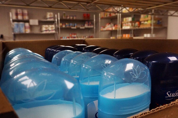 Hygiene items such as paper towels, laundry detergent, toothbrushes, deodorant, shampoo, and maxi pads are available in the pantries.