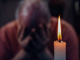 Image of grief-man with candle