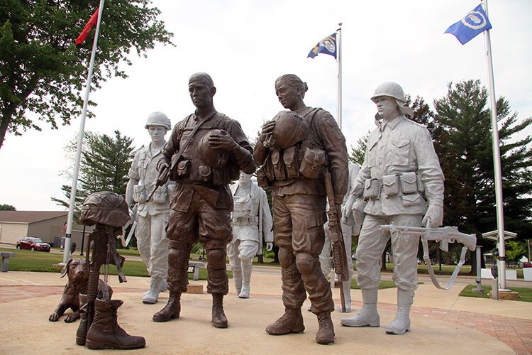 The Coleman Veterans Memorial features life-size sculptures of soldiers wearing the uniforms and gear each representing a different war.