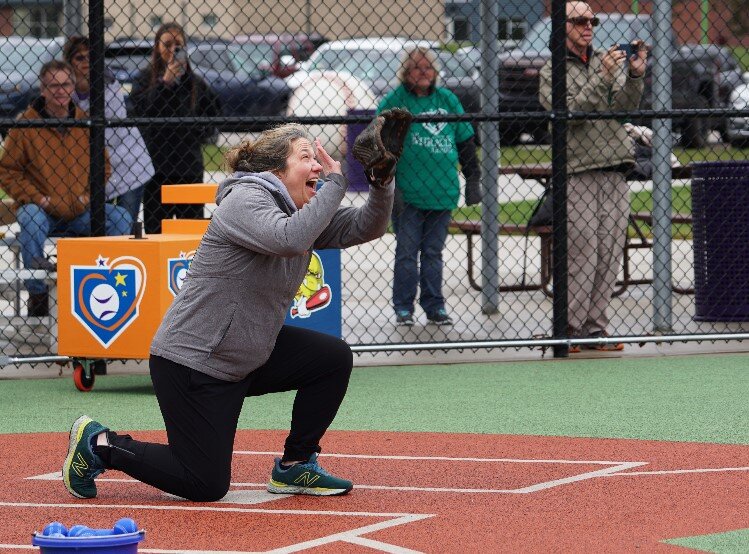 Marcie Post attempts to catch the first pitches of the season–from every player at the same time. The Middle of the Mitt Miracle League kicked off its season on Saturday, April 29. 
