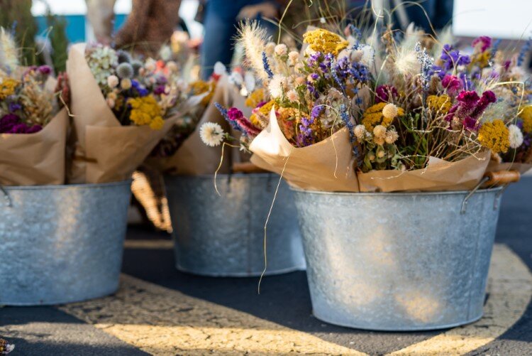 Family business Reinhardt Blooms, based in Kawkawlin, shows off their colorful displays of bright and beautiful bouquets. They have been vendors at the MAFM for several years.