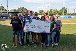 Check presentation to an MBF grant recipient at a Great Lakes Loons game.