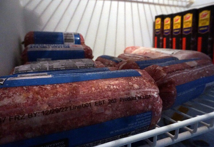 Freezers full of meat and bread are available for clients to take what they need.