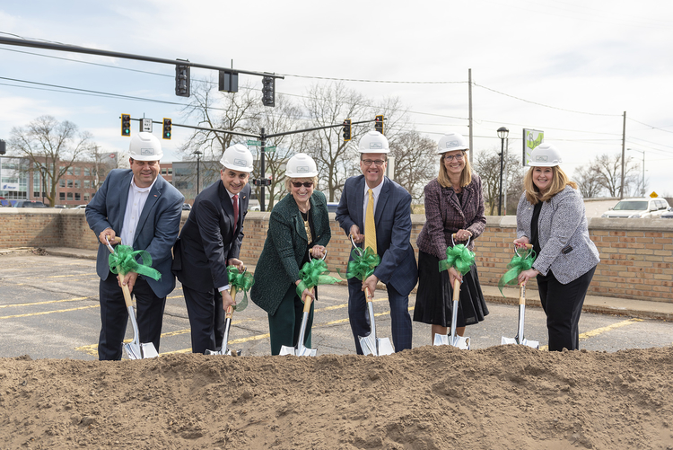 Local leaders dig in a break ground on the new Delta College Downtown Midland Center.